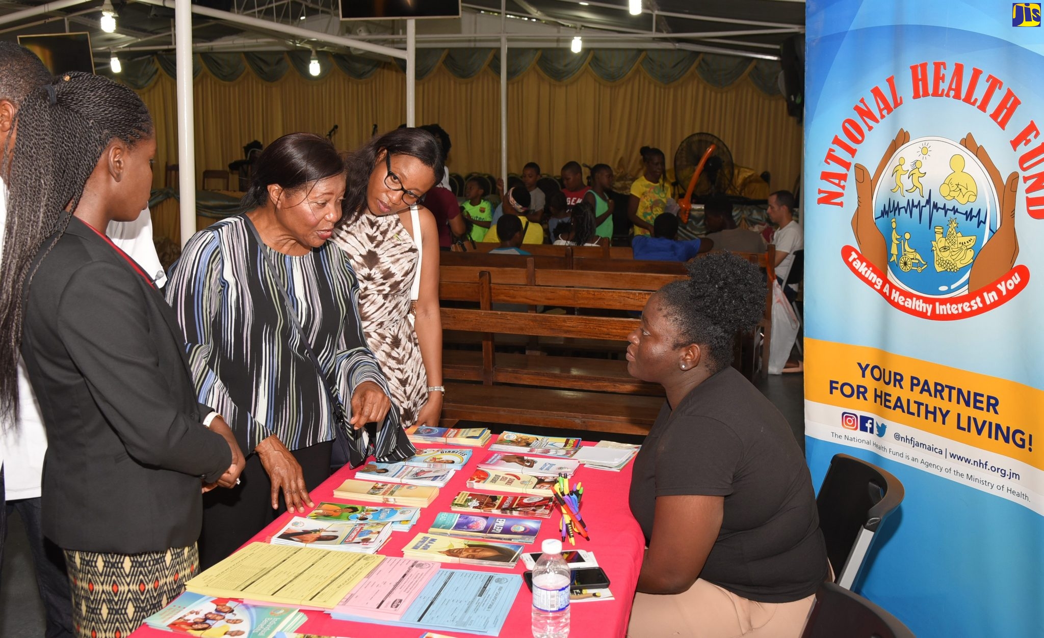 Wife of the Governor-General, Her Excellency, the Most Hon. Lady Allen (2nd left) speaks with Promotion Agent at the National Health Fund, Shanakay Dewar (right) at the health fair for the Greenwich Town Community on August 10. Others from left are: Coordinator of the health fair, Dr Teneisha Stephenson Harris and National Coordinator for the Governor General's Programme for Excellence, Sonja Simms.