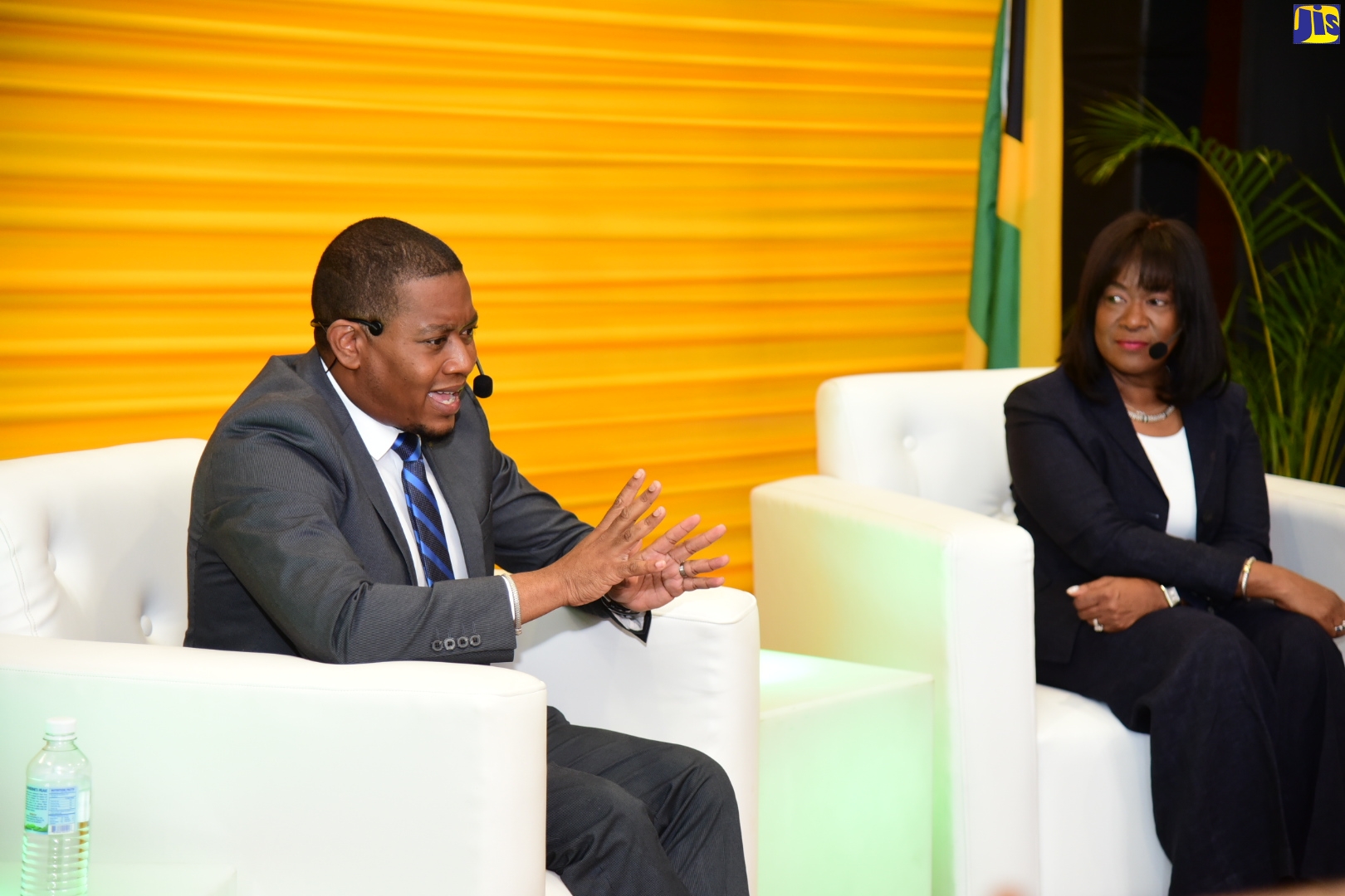 Minister without Portfolio in the Office of the Prime Minister, Hon. Floyd Green (left), engages in discussion about the Government’s digitisation process with Chief Digital Officer and Corporate Vice President, Microsoft US Global Technology Leader, Jacky Wright, during a special ‘Riverside Chat’ segment focusing on the National Identification System (NIDS) at the Jamaica 60 Diaspora Conference, at the Ministry of Foreign Affairs and Foreign Trade office in downtown Kingston on Tuesday (June 14).