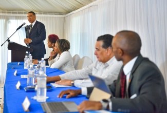 Prime Minister, the Most Hon. Andrew Holness, delivers the keynote address during the Office of the Prime Minister’s (OPM) strategic planning retreat, held recently at the Terra Nova All Suite Hotel in St. Andrew. Listening (from left) are: Chief Technical Director, OPM, Shereika Hemmings Allison; Minister without Portfolio with Responsibility for Skills and Digital Transformation, Senator Dr. the Hon. Dana Morris Dixon; Minister of State, Hon. Homer Davis; and Permanent Secretary, Ambassador Dr. Rocky Meade.


