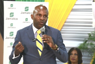 General Secretary of the Jamaica Teachers’ Association (JTA), Dr. Mark Nicely, delivers the keynote address during Jamalco’s Scholarship Awards ceremony on Tuesday (August 13) at the Wembley Centre of Excellence in Clarendon. As part of Jamalco’s Education Assistance Programme, 80 students from the parishes of Clarendon and Manchester received assistance for the upcoming school year.

