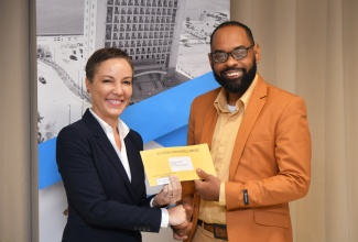 Minister of Foreign Affairs and Foreign Trade, Senator the Hon. Kamina Johnson Smith, presents a cheque, valued US$5,218, to Chairman of the St. Elizabeth Municipal Corporation and Mayor of Black River, Councillor Richard Solomon, for the St. Elizabeth infirmary during a brief handover ceremony at the Ministry’s office in downtown Kingston on Wednesday (February 5). The funds were raised by Jamaicans living in the Washington DC (District of Columbia), Maryland and Virginia (DMV) area in the United States, during a church service to commemorate the island’s 62nd Independence Anniversary.

