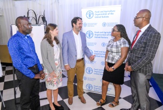 Policy Officer for Environment and Climate Change at the Food and Agriculture Organization (FAO) of the United Nations, Jacinto Buenfil (centre), converses with (from left) Director of Project Monitoring and Evaluation in the Ministry of Agriculture, Fisheries and Mining, Ian Chambers; Associate Professional Officer in Climate Change and Environment at the FAO Subregional Office for the Caribbean, Lindis Norlund; Senior Technical Officer of Adaptation in the Climate Change Branch within the Ministry of Economic Growth and Job Creation, Sharisa Buckle, and Manager of Systems Operation and Environment at Jamaica Social Investment Fund (JSIF), Dr. Milton Clarke. The occasion was a stakeholder validation workshop for the ‘Adapt Jamaica: Enhancing Climate Change Resilience of Vulnerable Smallholders in Central Jamaica’ Project at the Terra Nova All-Suite Hotel in St. Andrw on Thursday (March 27).

