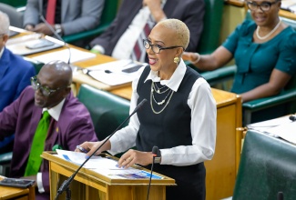 Minister of Finance and the Public Service, Hon. Fayval Williams, speaks in the House of Representatives on Tuesday (March 25).

