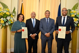 Governor-General, His Excellency the Most Hon. Sir Patrick Allen (second left) and Prime Minister, Dr. the Most Hon. Andrew Holness (second right), share a moment with Senators, Hon. Ambassador Audrey Marks and Hon. Delano Seiveright (right), who were sworn in this morning (March 17), during a ceremony held at King’s House. Senator Marks has been appointed Minister without Portfolio in the Office of the Prime Minister with responsibility for Efficiency, Innovation and Digital Transformation, while Senator Seiveright was named Minister of State in the Ministry of Tourism.
