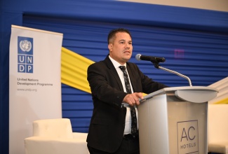Minister without Portfolio in the Ministry of Economic Growth and Job Creation, Hon. Matthew Samuda, delivers remarks during the opening ceremony for Jamaica’s National Consultation for the 30th United Nations Climate Change Conference, also known as the Conference of the Parties (COP30), at the AC Hotel by Marriott Kingston on Tuesday (March 25).

