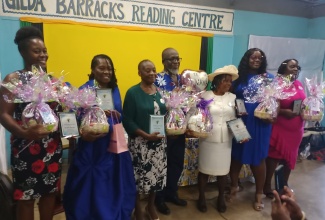 Chairman of the Kitson Town Civic Committee, Garfield Angus (centre), celebrates with the six mothers who received the inaugural Miss Govie Motherhood Awards, on May 18 at the Guanaboa Vale Primary School in St. Catherine.

