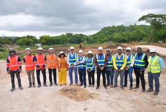 Prime Minister, Dr. the Most Hon. Andrew Holness (sixth left), is photographed on Wednesday (May 21) at the Rio Cobre Water Treatment Plant project site in Content, St. Catherine, where excavation work is being carried out prior to the start of construction. Other participants (from left) are VINCI Construction Grands Projects Civil Works Supervisor, Abdul Khan, Project Manager, Thomas Savary, Jamaica Country Manager, Timothee Delebarre, and Director of Water, Geoffrey Desportes; Member of Parliament, St. Catherine North Central, Natalie Neita Garvey; Minister without Portfolio in the Ministry of Economic Growth and Job Creation with Responsibility for Water, Hon. Matthew Samuda; Permanent Secretary, Ministry of Economic Growth and Job Creation, Arlene Williams; Acting President, National Water Commission (NWC), Kevin Kerr; Councillor, Sligoville Division, Dwight Burke; NWC Regional Manager, St. Catherine and Clarendon, Garwaine Johnson, Vice President, Enterprise Development Performance Management, Glaister Cunningham, and Water Production and Distribution Manager, André Brown; and Independent Engineer from N.O. Whyte and Associates Limited, Noel Whyte.

