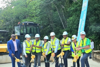 Prime Minister, Dr. the Most Hon. Andrew Holness (fourth right), and Minister without Portfolio in the Ministry of Economic Growth and Job Creation with Responsibility for Works, Hon. Robert Morgan (third right), lead the symbolic breaking of ground for the Port Antonio Bypass project in Portland on Thursday (June 26). 

