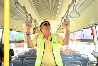 Minister of Science, Energy, Telecommunications and Transport, Hon. Daryl Vaz, aboard one of the new compressed natural gas (CNG) buses, procured for the Jamaica Urban Transit Company (JUTC). Mr. Vaz was on site for the arrival at Kingston Wharves on Thursday (June 19).

