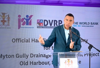 Prime Minister, Dr. the Most Hon. Andrew Holness, delivers the main address at the ribbon-cutting ceremony for the Myton Gully Drainage Improvement Project in Old Harbour, St. Catherine, on Tuesday (June 10).

