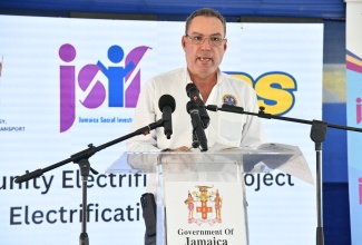 Minister of Science, Energy, Telecommunications and Transport, Hon. Daryl Vaz, delivers the keynote address during Thursday’s (June 12) launch of the Jamaica Social Investment Fund (JSIF) Rural Electrification Project in Hampstead Park, St. Andrew Eastern.

