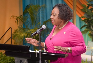 Minister of Culture, Gender, Entertainment and Sport, Hon. Olivia Grange, delivers the keynote address during the Ministry’s Outstanding Father Awards Ceremony on June 13 at The Jamaica Pegasus hotel in New Kingston. The event was held under the theme ‘The Power of Presence: Fathers Who Make a Difference’.

