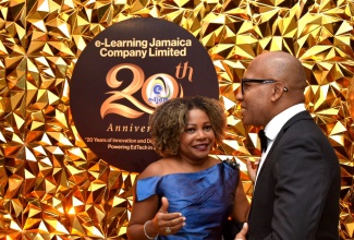 Education, Youth, Skills, and Information Minister, Senator Dr. the Hon. Dana Morris Dixon (left), in conversation with Chief Executive Officer of e-Learning Jamaica, Andrew Lee, during the e-Learning Jamaica’s 20th Anniversary Gala and Awards Ceremony, on June 20 at The Jamaica Pegasus hotel in Kingston.

