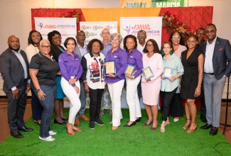 Minister of Culture, Gender, Entertainment and Sport, Hon. Olivia Grange (third left, front row), with officials of her Ministry, and stakeholders in the sport sector, at a recent ‘Safeguarding in Sport’ seminar, held at the Ministry in New Kingston.

