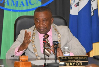 Mayor of Kingston, Councillor Andrew Swaby, addresses the monthly meeting of the Kingston and St. Andrew Municipal Corporation (KSAMC) on Tuesday (June 10). The sitting was held at the Corporation’s offices in downtown Kingston.