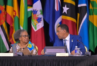 Chairman of the Caribbean Community (CARICOM) and Prime Minister of Jamaica, Dr. the Most Hon. Andrew Holness, in conversation with CARICOM Secretary General, Dr. Carla Barnett, during a press conference at the close of the 49th Regular Meeting of the Conference of Heads of Government of CARICOM, on Tuesday (July 8). The conference was held at the Montego Bay Convention Centre in St. James, from July 6 to 8.

