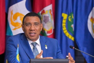 Prime Minister of Jamaica and CARICOM Chair, Dr. the Most Hon. Andrew Holness (centre), addresses the closing press conference of the 49th Regular Meeting of the Conference of Heads of Government of CARICOM, at the Montego Bay Convention Centre in St. James on Tuesday (July 8). 