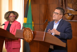 Minister without Portfolio in the Ministry of Economic Growth and Job Creation, Hon. Matthew Samuda (right), addresses a Special Press Briefing on Wednesday (July 16) at Jamaica House. Looking on is Minister of Education, Skills, Youth and Information, Senator Dr. the Hon. Dana Morris Dixon.