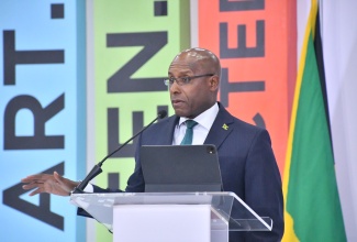 Minister of Industry, Investment and Commerce, Senator the Hon. Aubyn Hill, addresses the opening ceremony of the Caribbean Investment Forum (CIF), at the Montego Bay Convention Centre in St. James, on Tuesday (July 29). The forum concludes on July 31. 

