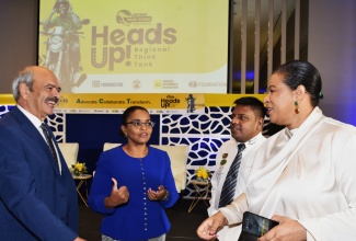 Technical Assistant in the Ministry of Science, Energy, Telecommunications and Transport, Donaree Muirhead (right), engages in discussion with (from left) President, Fédération Internationale de l'Automobile (FIA) Region III, Frank Fotia; General Manager of the JN Foundation, Claudine Allen; and Director/Secretary General, Trinidad and Tobago Automobile Association, Selwyn Richard Persad. Occasion was the recent National Helmet Wearing Coalition (NHWC) Regional ‘Heads Up’ Think Tank held at the AC Hotel by Marriott, Kingston.