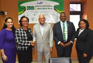 Minister of Justice,  Hon. Delroy Chuck (centre), with (from left) Deputy Solicitor General, Catherine Williams; Senior Puisne Judge, Supreme Court of Jamaica, Hon. Mrs. Justice Lorna Shelly-Williams; Caribbean Association of Law Libraries (CARALL) President, Dwaymian Brissette; and Conference Chairperson, Nicole Walters Wellington. The event was the opening ceremony for the 39th CARALL hybrid Conference and Annual General Meeting, on Monday (July 28), at the University of the West Indies, Mona Campus, in Kingston. The Conference is being held from July 28 to 31.