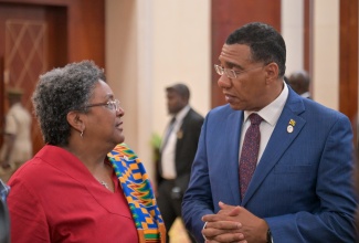 Chair of CARICOM and Prime Minister of Jamaica, Dr. the Most Hon. Andrew Holness, in conversation with former CARICOM Chair and Prime Minister of Barbados, Hon. Mia Mottley, during the opening ceremony for the 49th Regular Meeting of the Conference of Heads of Government of CARICOM. The opening ceremony was held at the Montego Bay Convention Centre in St. James, on Sunday (July 6).

