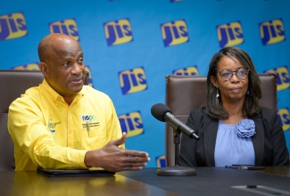 Director for Environmental Management and Conservation at the National Environment and Planning Agency (NEPA), Anthony McKenzie, addresses a recent JIS Think Tank.  Listening is Chief Technical Director (CTD) for Development Planning, Environment Policy and Management in the Ministry of Economic Growth and Job Creation, Gillian Guthrie.

