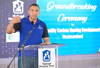 Prime Minister, Dr. the Most Hon. Andrew Holness, addresses the ceremony to break ground for the National Housing Trust (NHT) Chantilly Gardens housing development in Westmoreland, on Friday (July 18). 

