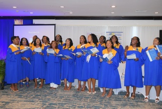 Graduates of the Tax Audit and Revenue Administration (TARA) Postgraduate Diploma Programme perform during Friday’s (July 25) graduation ceremony at the Jamaica Pegasus Hotel in New Kingston.