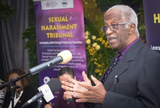 Chair of the Sexual Harassment Tribunal, Justice Ferdinand Smith (Retired), delivers remarks during the Sexual Harassment Tribunal Swearing-in Ceremony and Designation of Authorised Officers, held on Thursday (July 17), at the Ministry of Culture, Gender, Entertainment and Sport, in New Kingston. Eighteen Authorised Officers have been officially appointed to enforce provisions of the Sexual Harassment (Protection and Prevention) Act, 2021, while 14 Tribunal members were sworn in to adjudicate cases under the legislation islandwide.