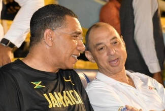 Prime Minister, the Most Hon. Andrew Holness (left) and the late Senator Don Wehby (right), then Group Chief Executive Officer of GraceKennedy Limited, during the Boys and Girls' Athletics Championships on March 29, 2023. 