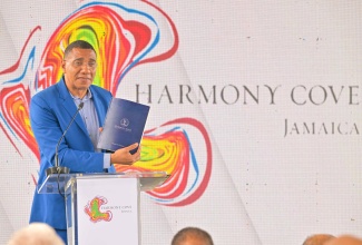 Prime Minister, Dr. the Most Hon. Andrew Holness, addresses the recent ribbon-cutting ceremony for the Harmony Cove development project in Duncans, Trelawny.

