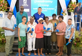 Prime Minister, Dr. the Most Hon. Andrew Holness (centre, back row), shares a moment with Westmoreland residents who received Smart Energy Grants from the National Housing Trust (NHT). Ocassion was the groundbreaking ceremony for the Trust's Chantilly Gardens development in the parish on Friday (July 18).