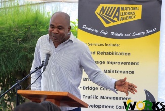 Minister of State in the Ministry of Finance and the Public Service, Hon. Zavia Mayne, addresses the recent ground-breaking ceremony of rehabilitation work to be carried out on the John Reid to Battersea roadway in rural St. Ann.

