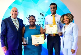 Minister of Education, Skills, Youth and Information, Senator Dr. the Hon. Dana Morris Dixon (right), and Chairman of the Sagicor Foundation Jamaica, Christopher Zacca (left), share a photo opportunity with special award recipients, during the Sagicor Foundation Scholarship Awards Ceremony, held at The Jamaica Pegasus hotel in New Kingston on Tuesday (August 12). They are (from second left) student at the University of the West Indies (UWI), Mona, Calicia Vassell, who copped the R. Danny Williams Visionary Award for Leadership and Volunteerism; and Northern Caribbean University (NCU) student, James Barrett, who earned the Chairman’s Innovation Award.

