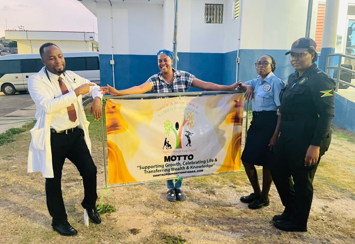 Spanish Town-based doctor, Dr. Suneil Morgan (left), who provided free medical service at a recent back-to-school treat organised by the Once A Man, Twice A Child Foundation and held at the Longville Park Police Station in Clarendon. Others pictured (from second left) are Founder of the Foundation, Corporal Rozanne Brown Witter; District Constable Joan Nugent; and Constable Vanessa Walker.