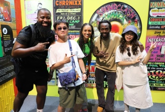 Digicel Rising Star 2024 winner, Akeen Fennell (left) and recording artistes Naomi Cowan (centre) and Jesse Royal (second right), share a photo opportunity with visitors at the Jamaica Pavilion at Expo 2025 Osaka, Kansai, Japan on Tuesday, August 5. The trio are currently in Japan to perform at the highly anticipated National Day Concert on Wednesday, August 6.