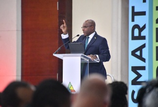Minister of Industry, Investment and Commerce, Senator the Hon. Aubyn Hill, addresses the opening ceremony of the Caribbean Investment Forum (CIF) held at the Montego Bay Convention Centre in St. James on Tuesday (July 29). 