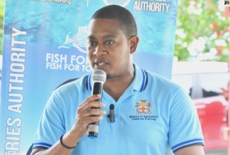 Minister of Agriculture, Fisheries and Mining, Hon. Floyd Green, addresses the handover ceremony for boats and engines to fishers from St. Elizabeth and Westmoreland, at the office of the  National Fisheries Authority (NFA), Black River, St. Elizabeth,  on Wednesday (August 13). 