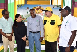 Custos of Clarendon, Hon. Edith Chin (second left), representing Governor-General, His Excellency the Most Hon. Sir Patrick Allen, engages in light conversation with (from left) Mayor of May Pen, Councillor Joel Williams; President of the Jamaica Agricultural Society (JAS), Owen Dobson; Leader of the Opposition, Mark Golding; and Chief Executive Officer of the JAS, Derron Grant. Occasion was the first day of the Denbigh Agricultural, Industrial and Food Show in May Pen, Clarendon on Friday (Aug.1).