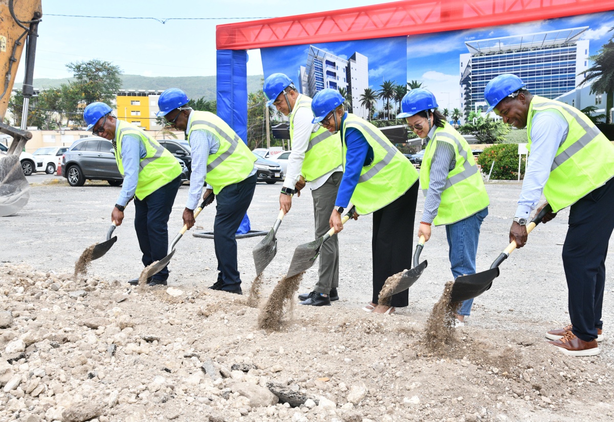 Minister of Health and Wellness, Dr. the Hon. Christopher Tufton (third left), and Member of Parliament for St. Andrew Eastern, Hon. Fayval Williams (fourth left), break ground for a new state-of-the-art medical tower at the University Hospital of the West Indies (UHWI) in St. Andrew, on August 7. Also taking part (from left) are Chief Executive Officer of the hospital, Fitzgerald Mitchell, Chairman of the institution, Patrick Hylton, Company Secretary for ZDA Construction, Carrie Zhang, and Medical Officer of Health at the Hospital, Dr. Carl Bruce.

